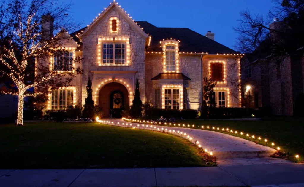 Nashville home with professionally installed Christmas lights along the roofline and walkway