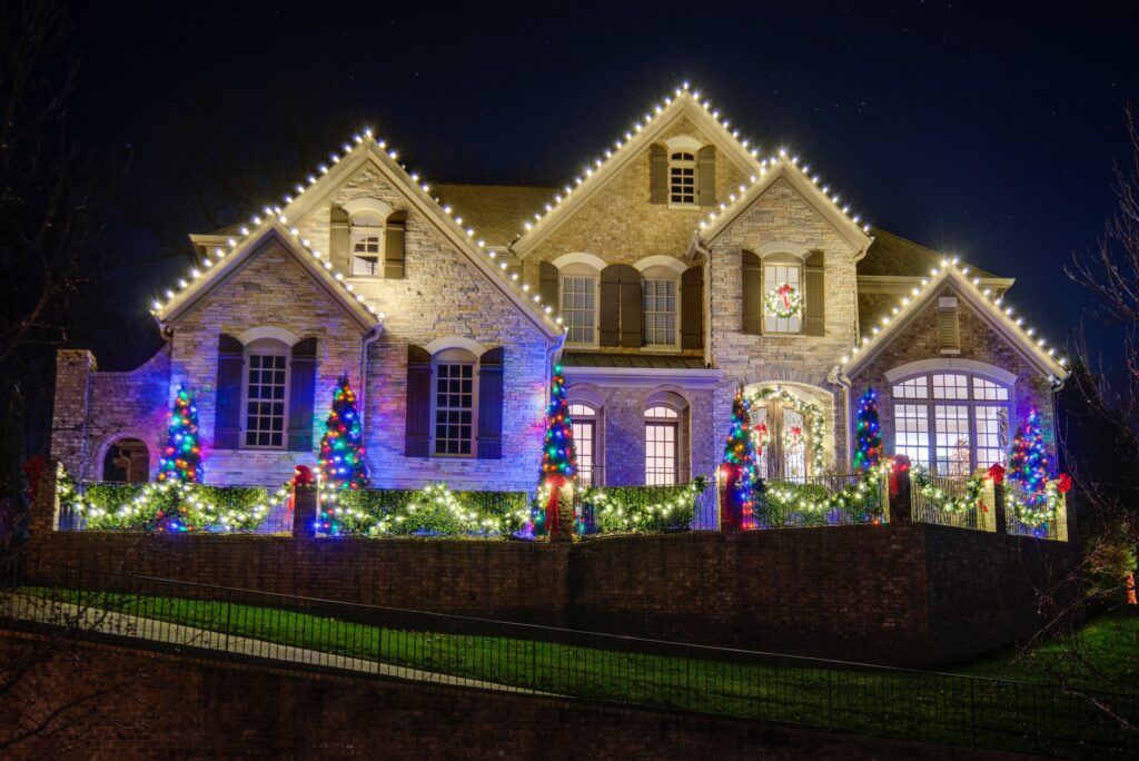 Christmas lights outlining the roof and gables of a Nashville home