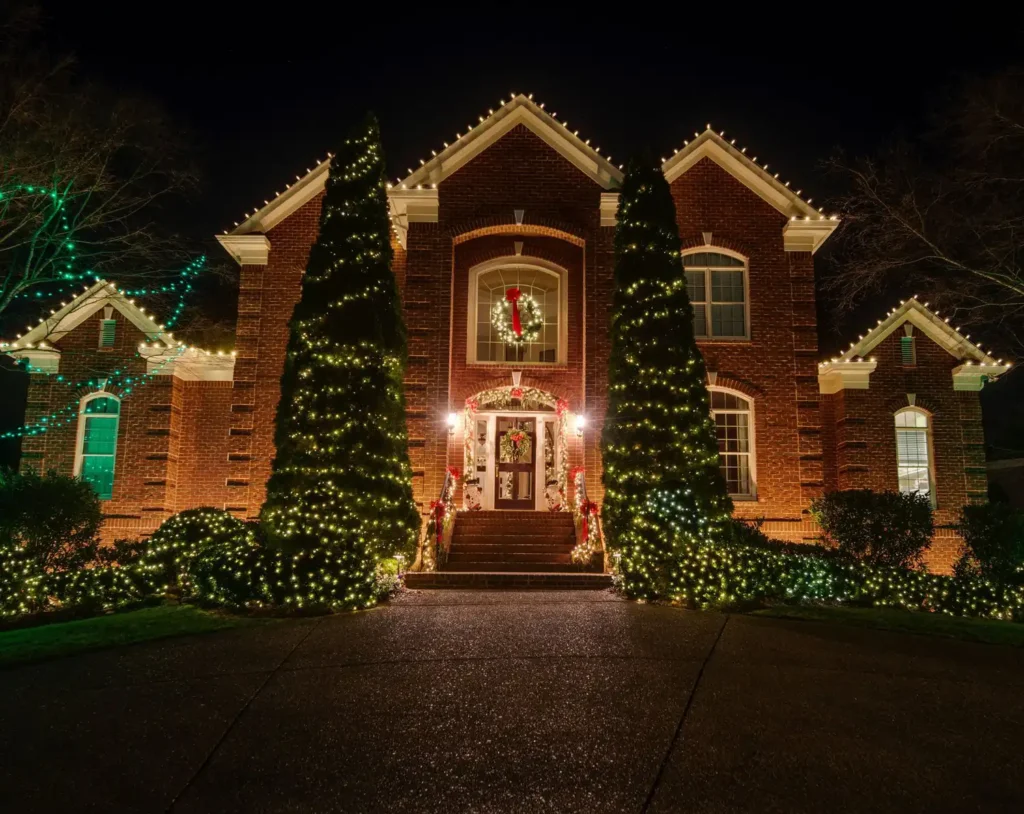 Christmas lights outlining the roof and gables of a Nashville home
